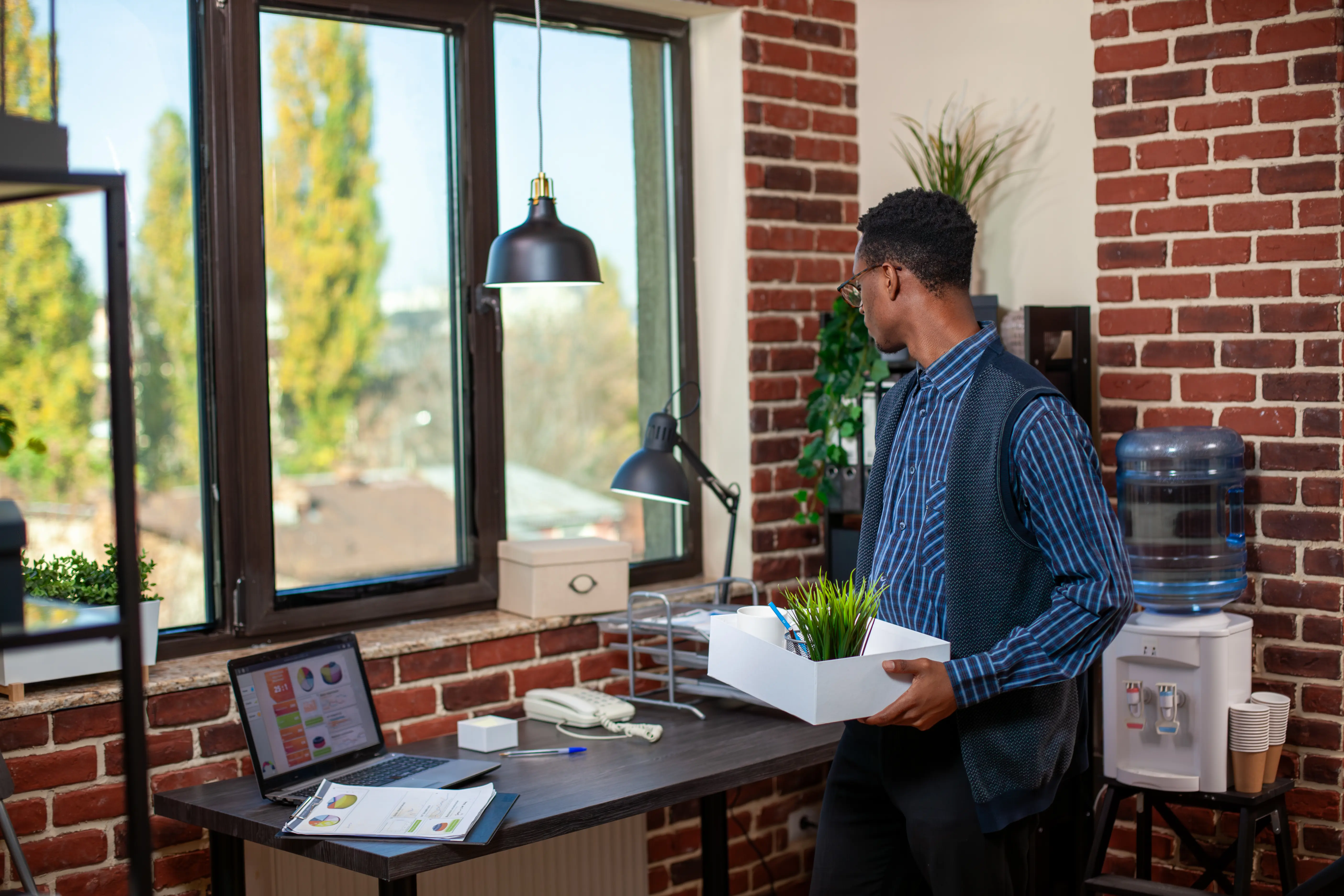 Businessman Preparing for Work in Office